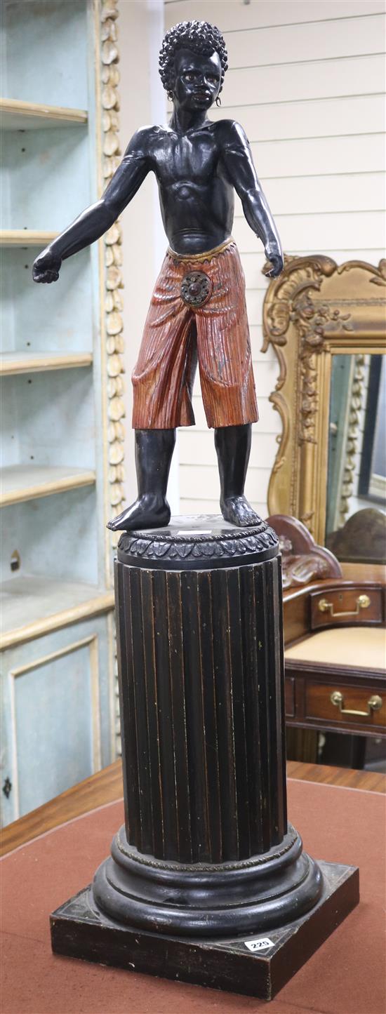 A carved wood Blackamoor figure on column height 115cm